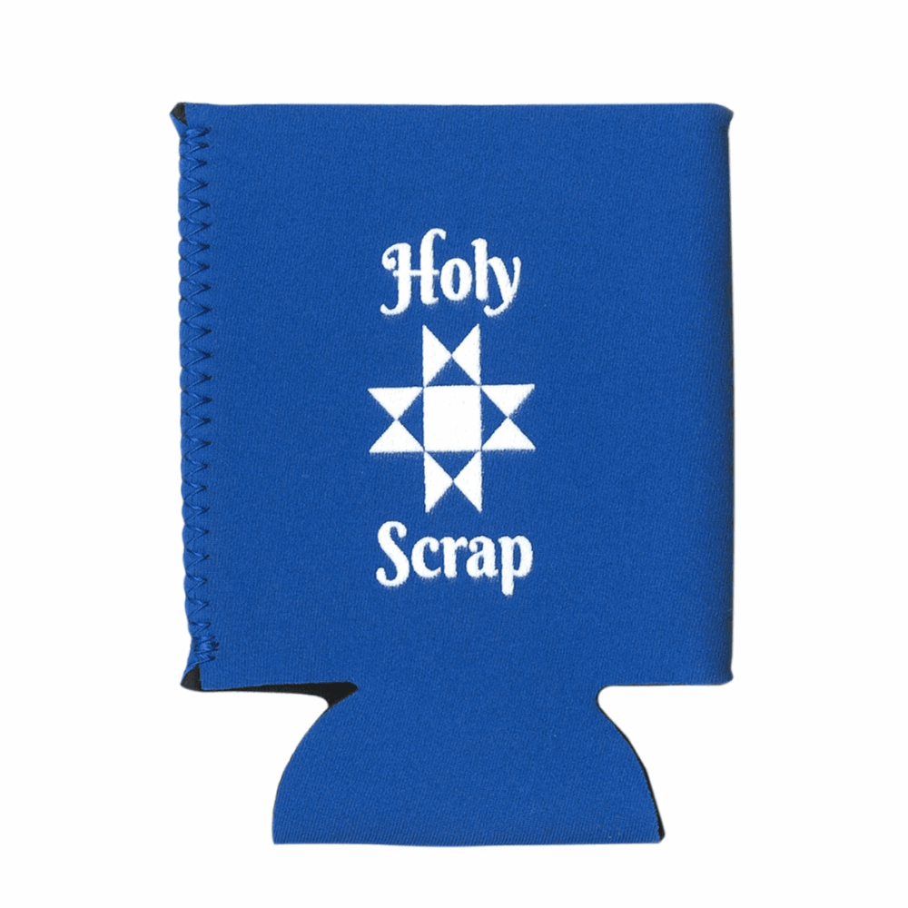 The "Holy Scrap" Can Cooler is made of royal blue neoprene with white lettering and features an Ohio Star quilt block in the center.