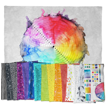 Colorful fabric swatches arranged in front of a color wheel on a textured gray background