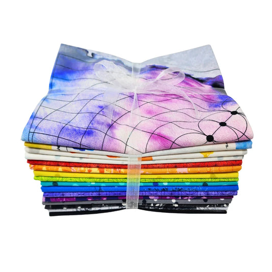 A stack of colorful patterned fabric squares tied together with a white ribbon, shown on a plain white background.
