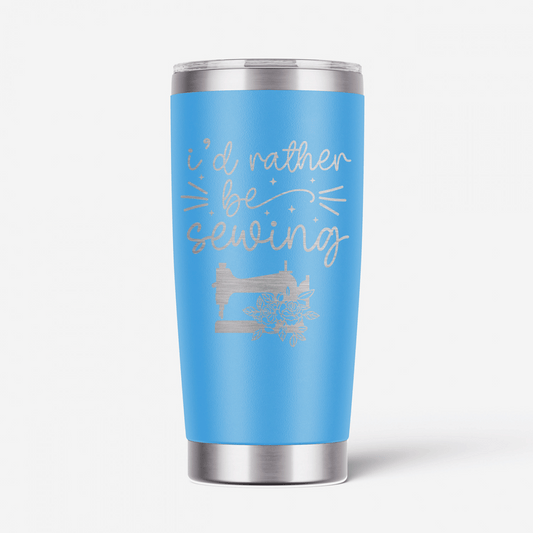 This I'd Rather Be Sewing Tumbler is a cheeky way of letting others know exactly where your happy place is - and it likely isn't where you currently are! This laser-engraved 20-oz blue and silver tumbler has double walls and a vacuum seal to keep your favorite drinks cold or hot for hours on end. 