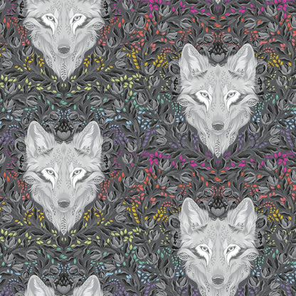 Pattern of wolf faces surrounded by colorful foliage on a dark background