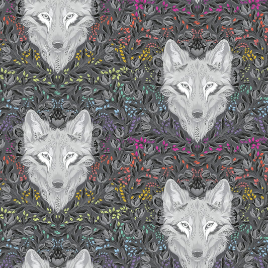 Pattern of wolf faces surrounded by colorful foliage on a dark background
