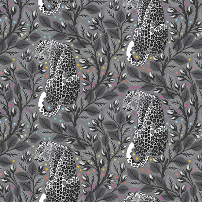 Pattern of leopards and leaves on a gray background dotted with rainbow accents