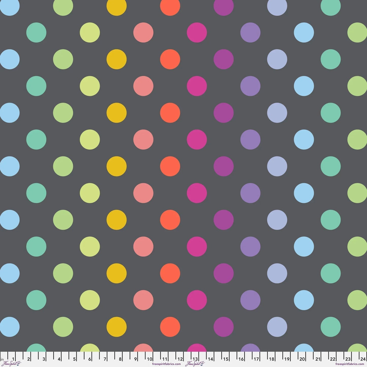 Pattern of colorful polka dots on a dark grey background with a ruler at the bottom for scale