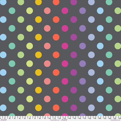 Pattern of colorful polka dots on a dark grey background with a ruler at the bottom for scale