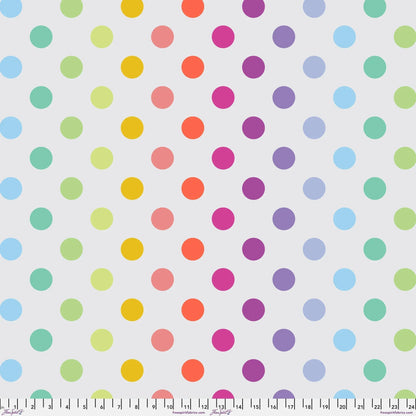 Pattern of colorful polka dots on a light grey background with a ruler at the bottom for scale