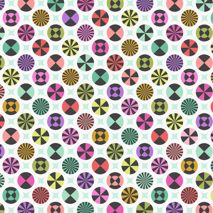 A repeating geometric pattern featuring colorful circles with radiating lines, pinwheels, and concentric circular motifs on a white background with faint pale green star shapes.