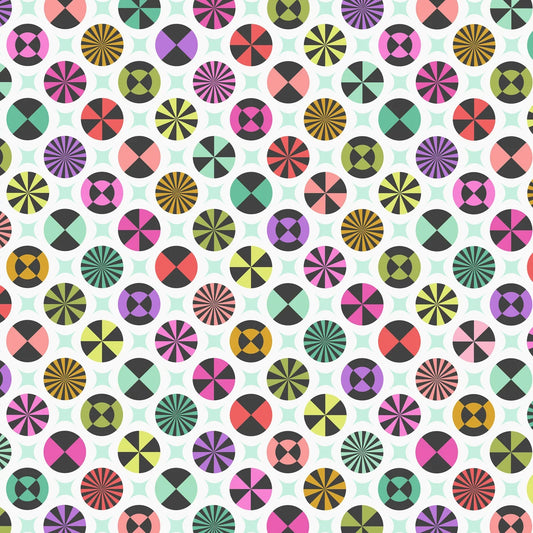 A repeating geometric pattern featuring colorful circles with radiating lines, pinwheels, and concentric circular motifs on a white background with faint pale green star shapes.
