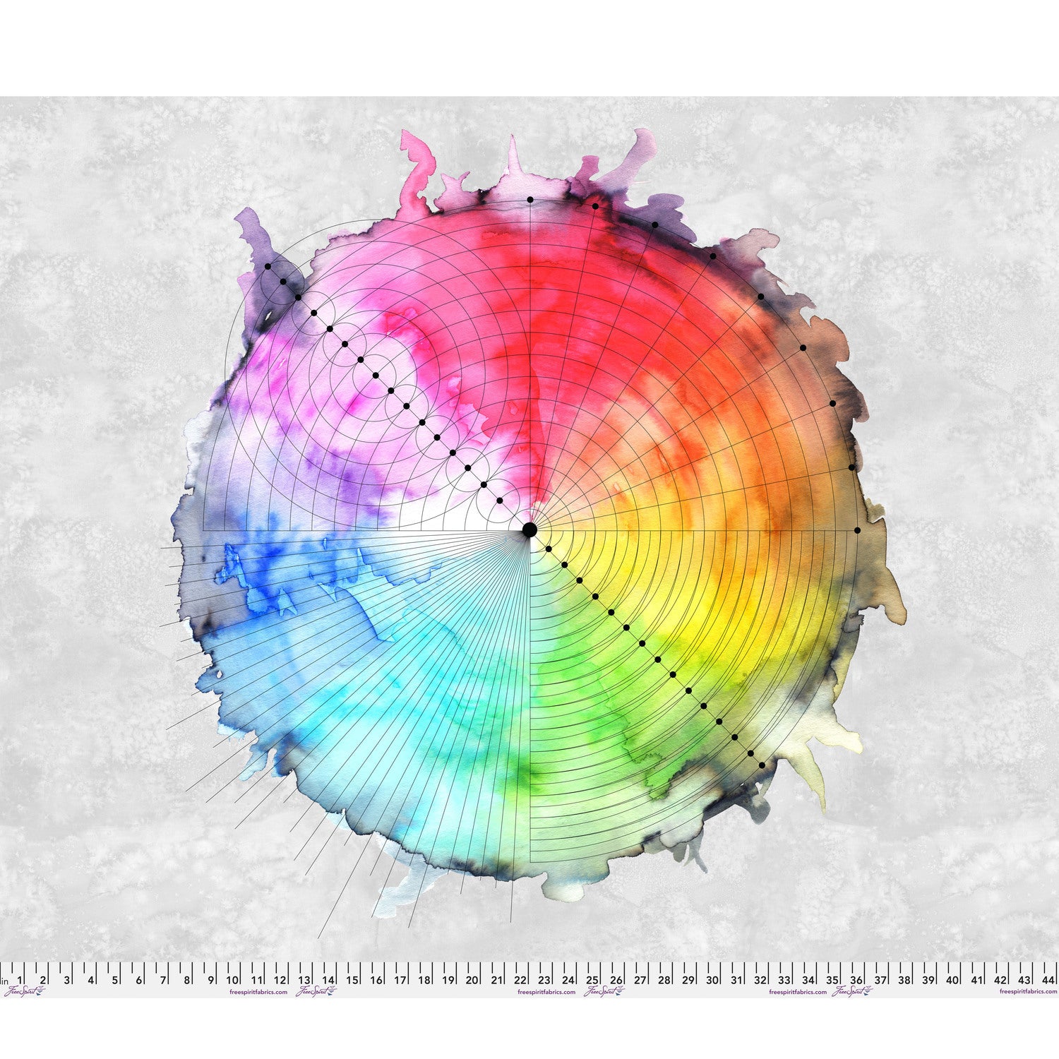 Color wheel with a blended gradient of colors on a textured grey background with a ruler at the bottom for scale.
