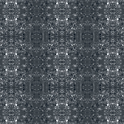 A seamless abstract fabric pattern featuring symmetrical, kaleidoscopic motifs in black, grey, and white.