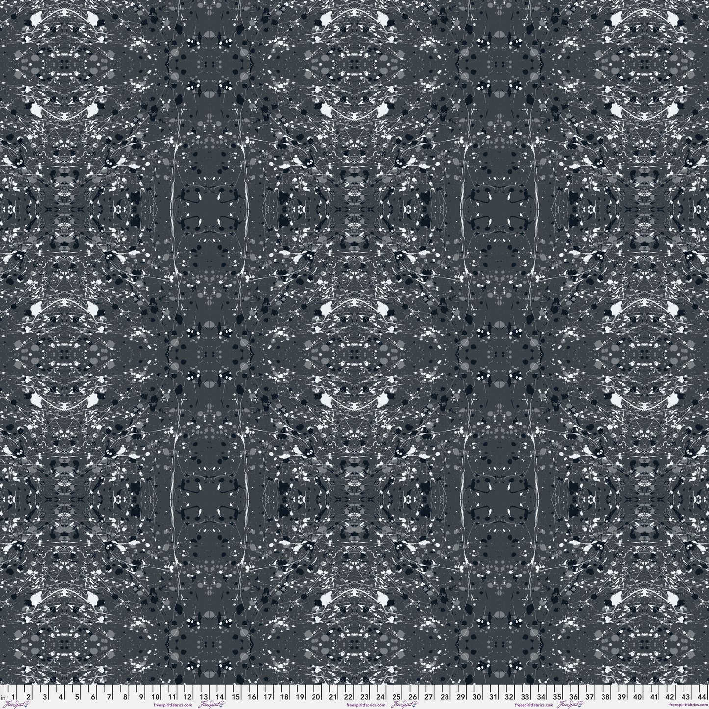 A seamless abstract fabric pattern featuring symmetrical, kaleidoscopic motifs in black, grey, and white, with a ruler at the bottom for scale.