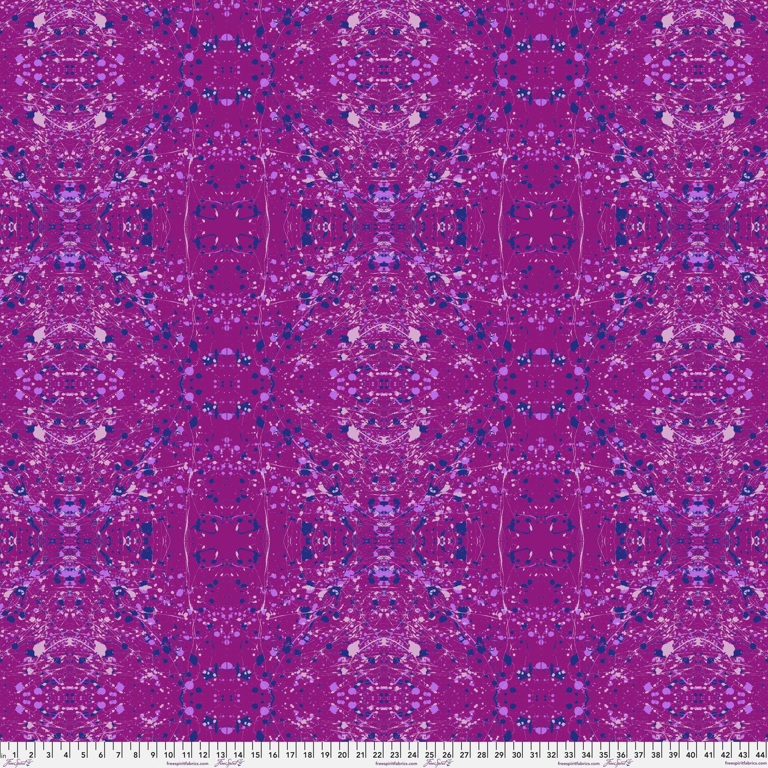 A seamless repeating fabric pattern featuring a symmetrical, kaleidoscopic design in vibrant purple, lavender, and navy blue tones. Ruler at the bottom for scale.