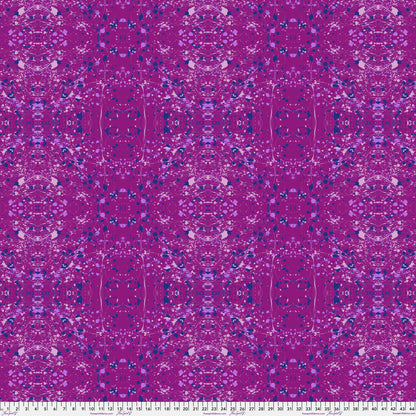 A seamless repeating fabric pattern featuring a symmetrical, kaleidoscopic design in vibrant purple, lavender, and navy blue tones. Ruler at the bottom for scale.