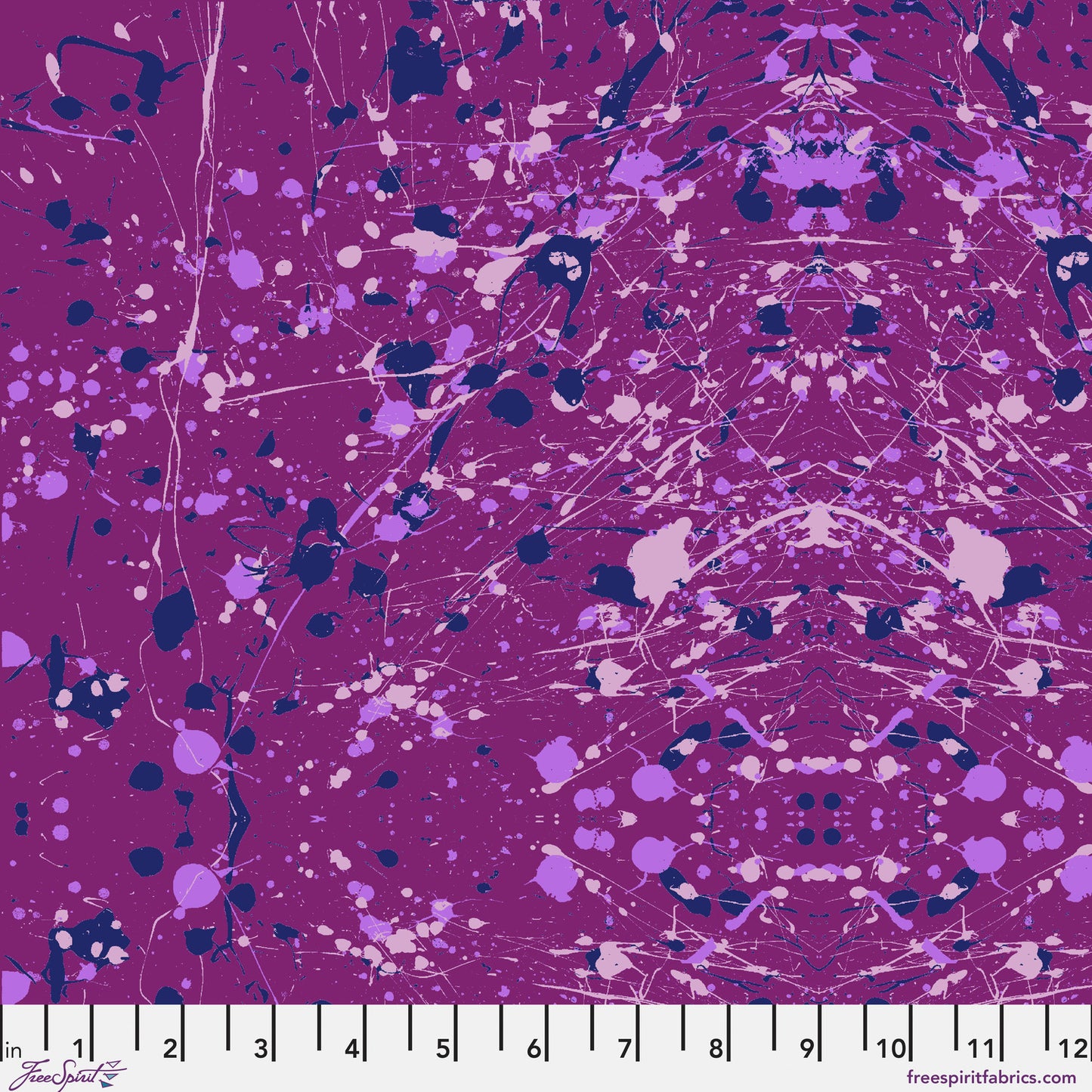 Abstract paint-splatter fabric pattern in bright purple, with scattered lavender and navy splashes and drips. Ruler at the bottom for scale.