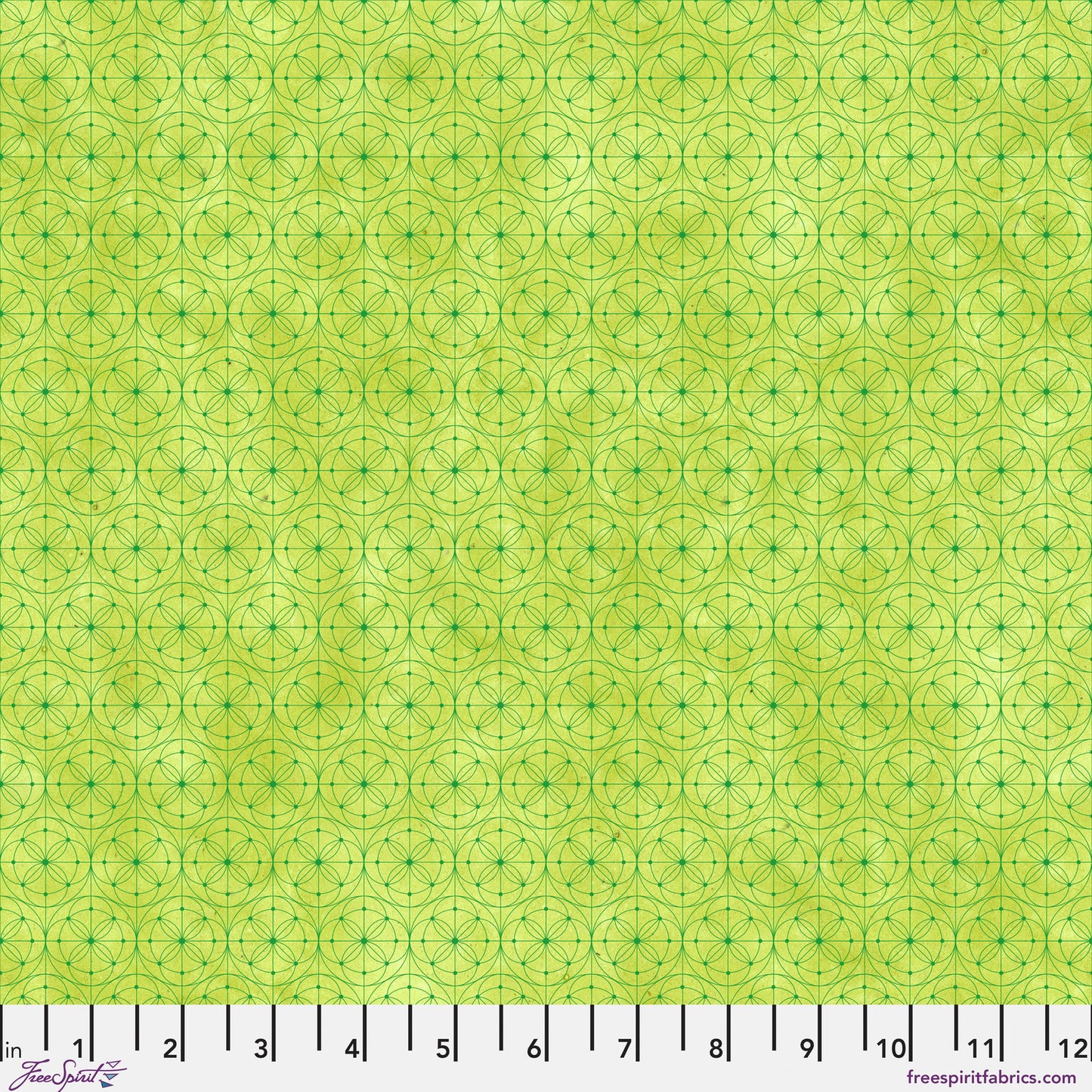 Fabric pattern featuring a repeating geometric design of interlocking circles and stars in lime green with a ruler along the bottom edge for scale.
