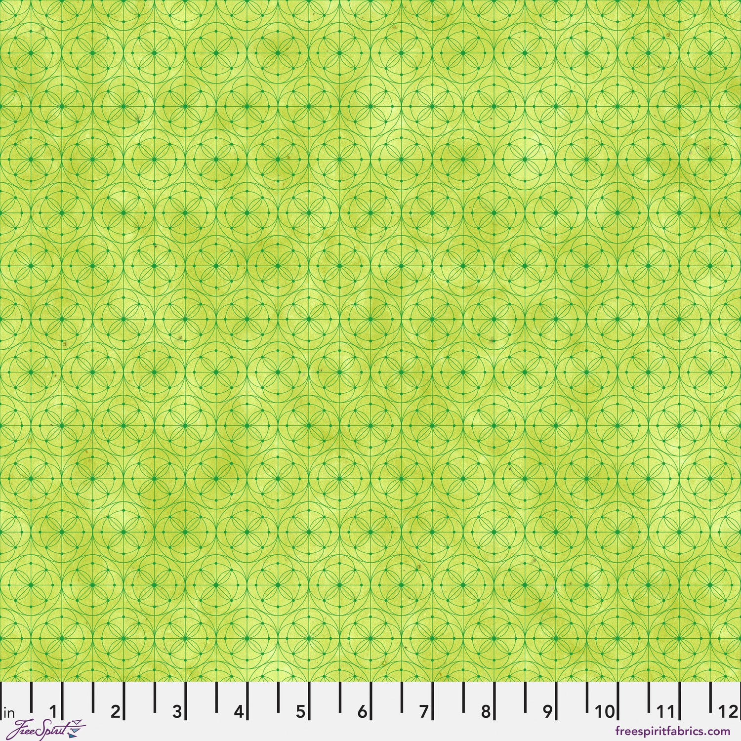 Fabric pattern featuring a repeating geometric design of interlocking circles and stars in lime green with a ruler along the bottom edge for scale.