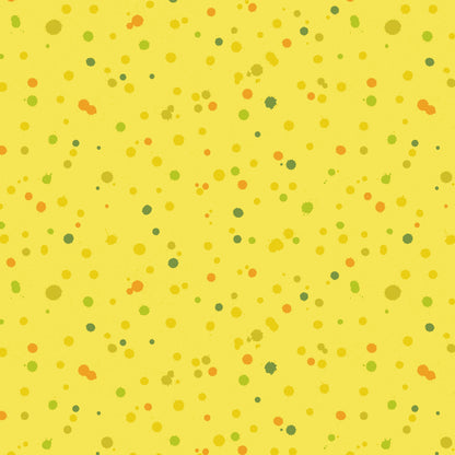 Fabric design of paint droplets in olive, orange, and chartreuse tones scattered across a warm, sunny yellow background.