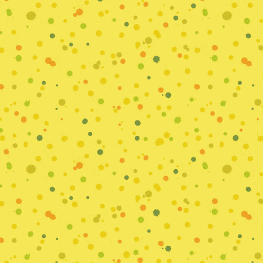 Fabric design of paint droplets in olive, orange, and chartreuse tones scattered across a warm, sunny yellow background.