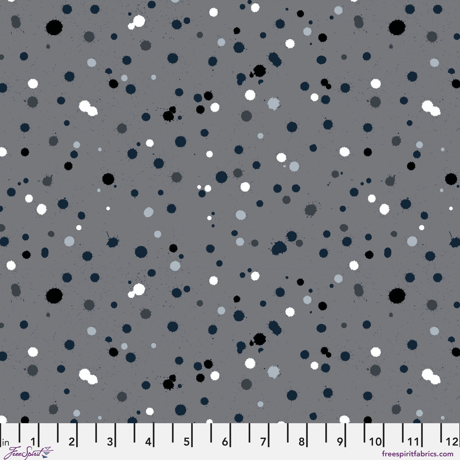 Fabric design with paint drops in black, white, and slate-grey tones scattered across a medium grey background. Ruler at the bottom for scale.