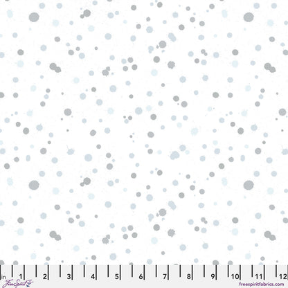 Fabric design of paint droplets in silver-grey and pale slate-blue tones scattered across a white background. Ruler at the bottom for scale.