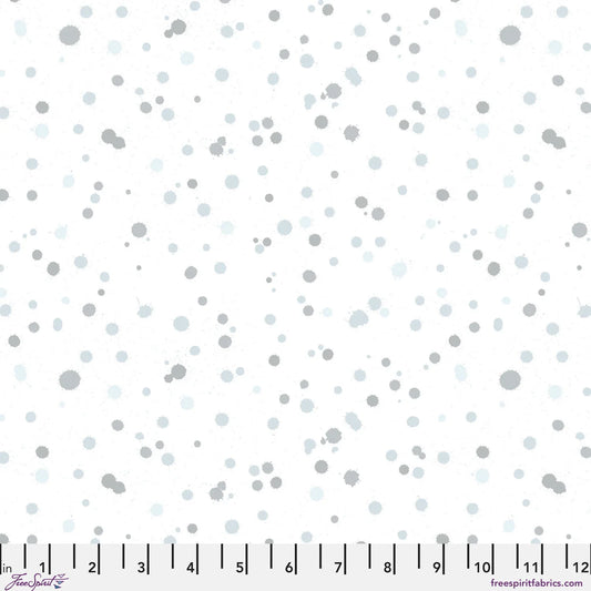 Fabric design of paint droplets in silver-grey and pale slate-blue tones scattered across a white background. Ruler at the bottom for scale.