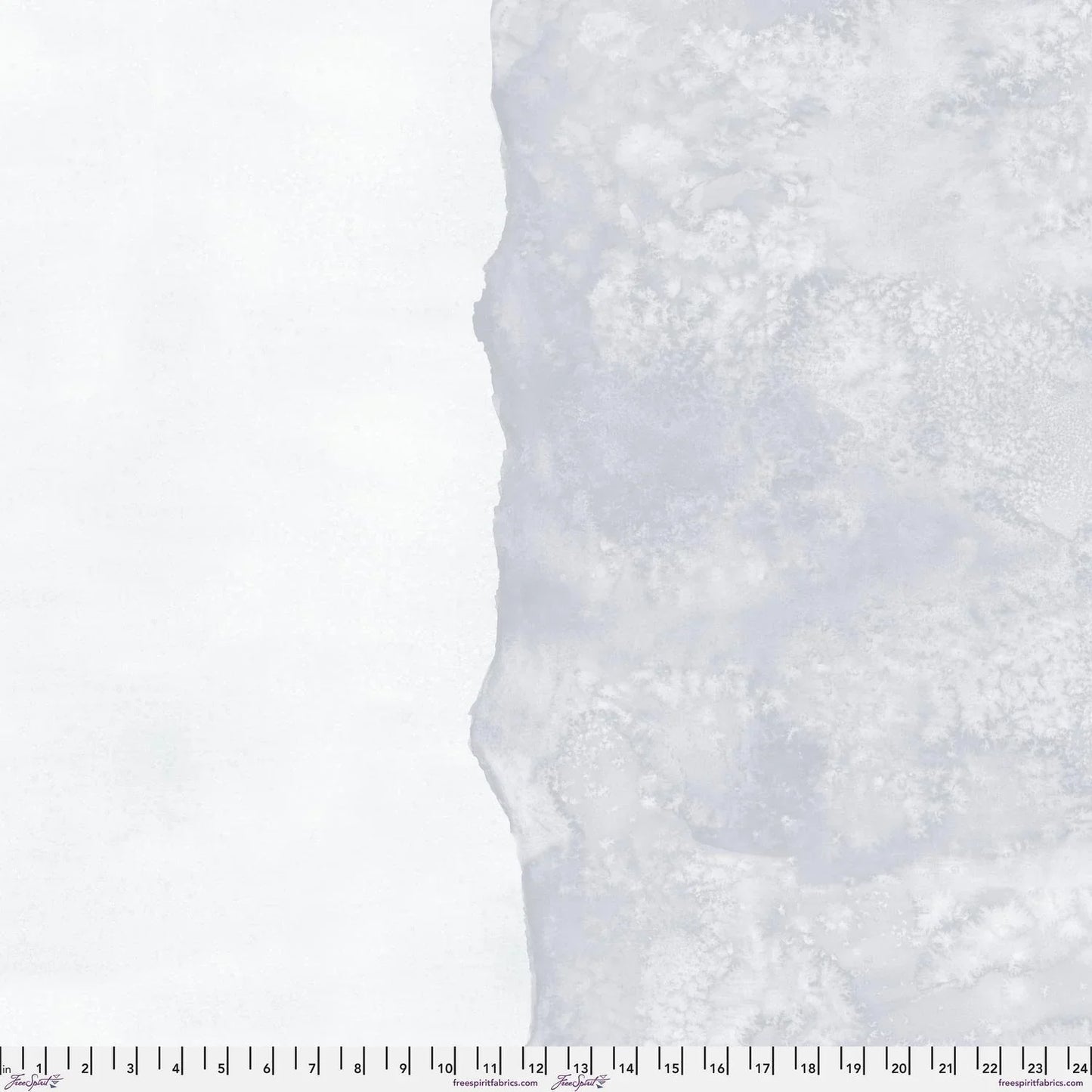 Abstract fabric pattern with a watercolor-like texture featuring silver-grey and clean, icy-white. Ruler at the bottom for scale.