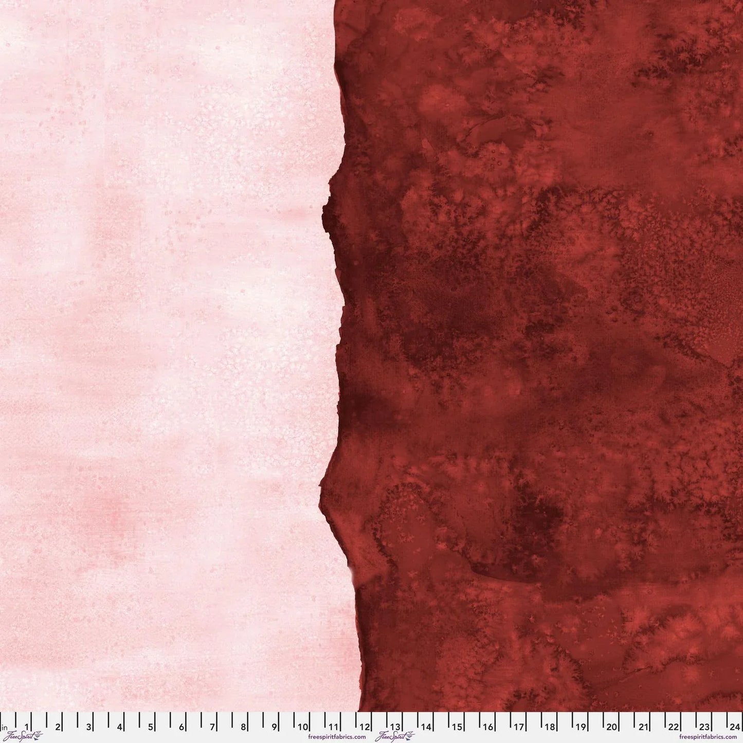Abstract fabric pattern with a watercolor-like texture featuring dark red and light, blush-pink. Ruler at the bottom for scale.