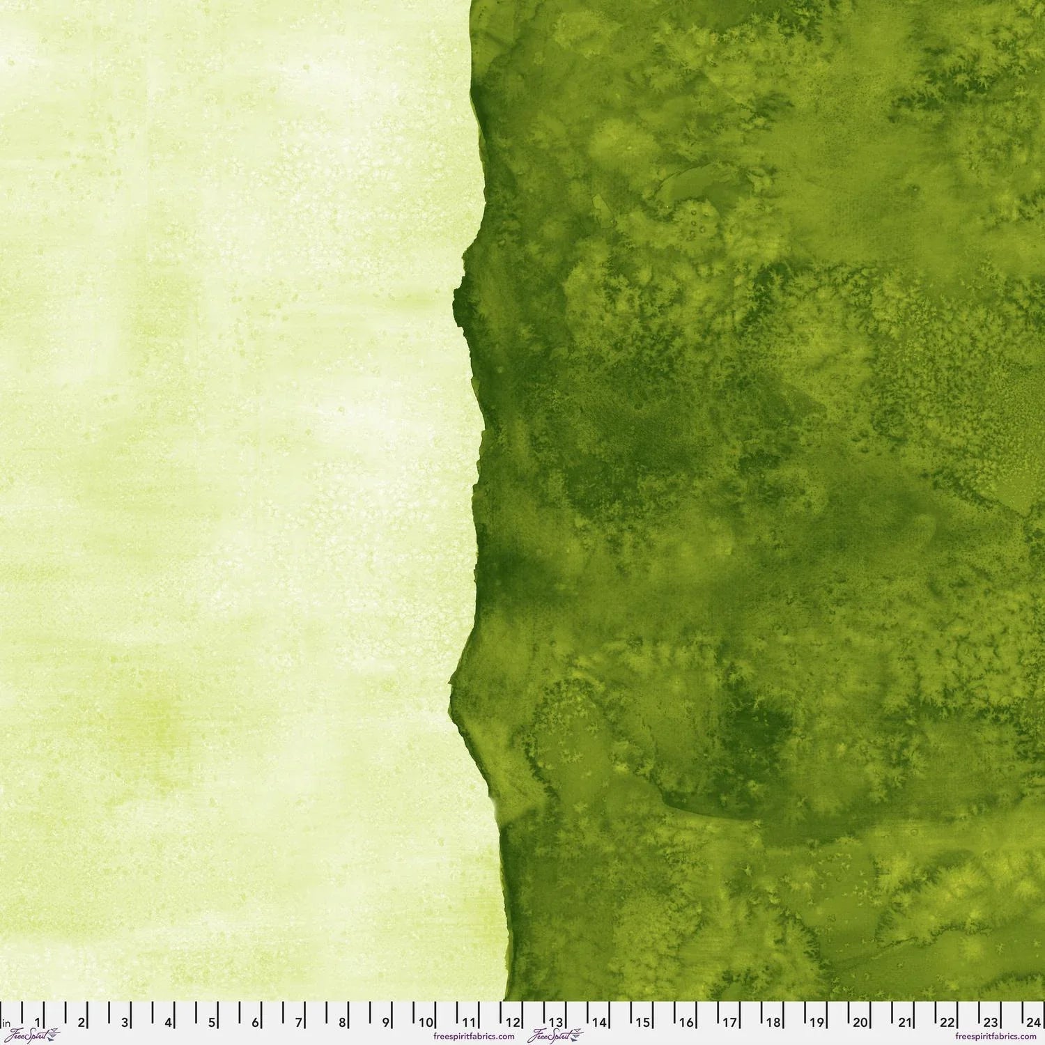 Abstract fabric pattern with a watercolor-like texture featuring dark emerald and light, lime green. Ruler at the bottom for scale.