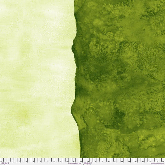 Abstract fabric pattern with a watercolor-like texture featuring dark emerald and light, lime green. Ruler at the bottom for scale.