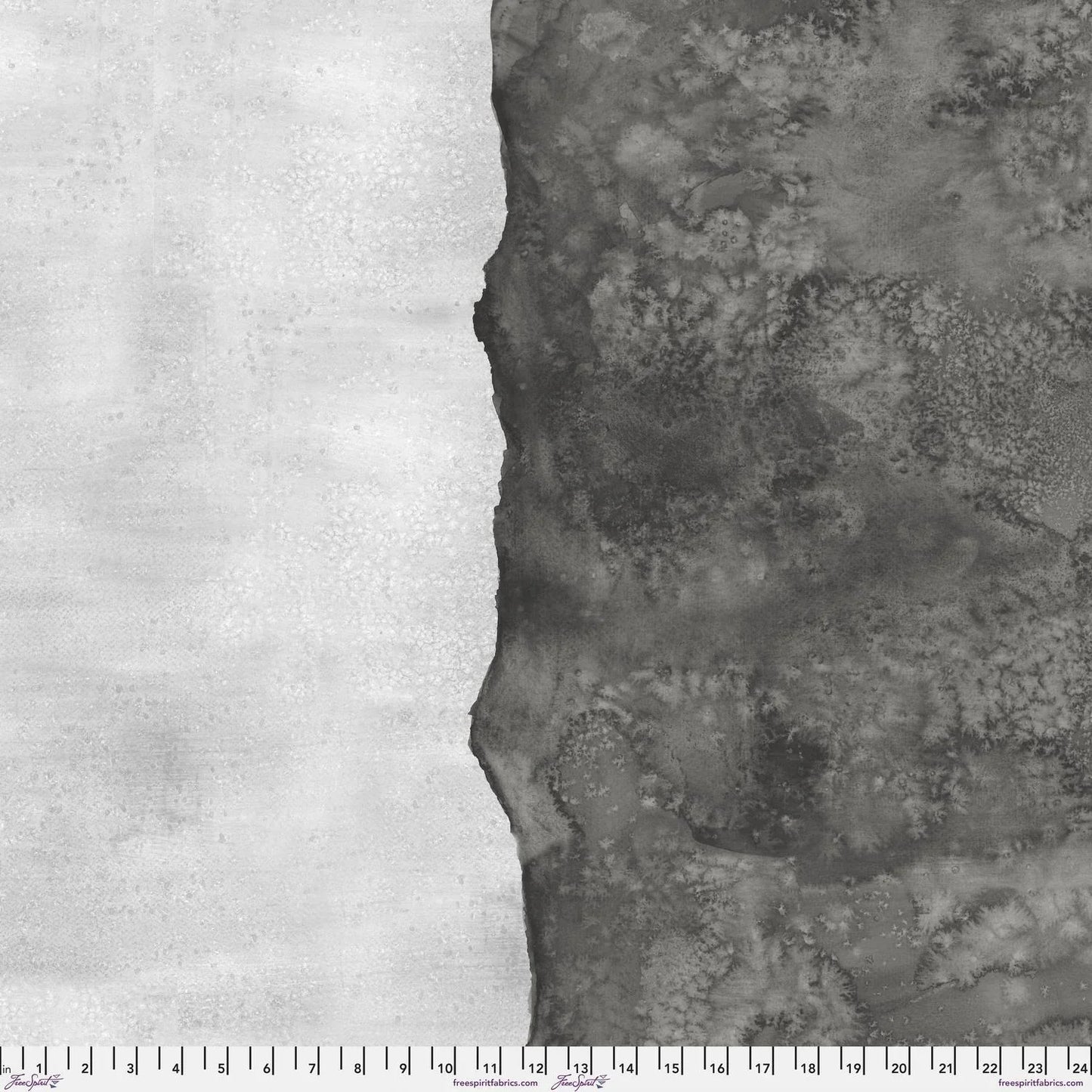Abstract fabric pattern with a watercolor-like texture featuring dark charcoal and light, silver-grey. Ruler at the bottom for scale.