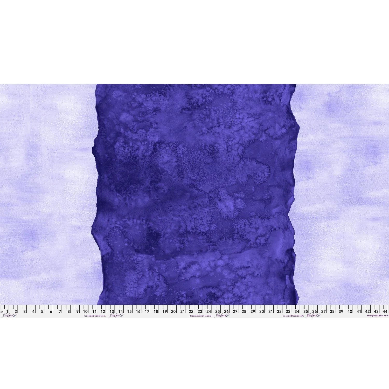 Abstract fabric pattern with a watercolor-like texture featuring a central stripe of dark indigo and outer light, lilac purple edges. Ruler at the bottom for scale.