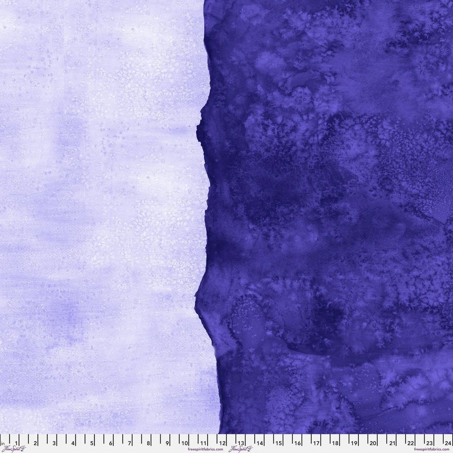 Abstract fabric pattern with a watercolor-like texture featuring dark indigo and light, lilac purple. Ruler at the bottom for scale.