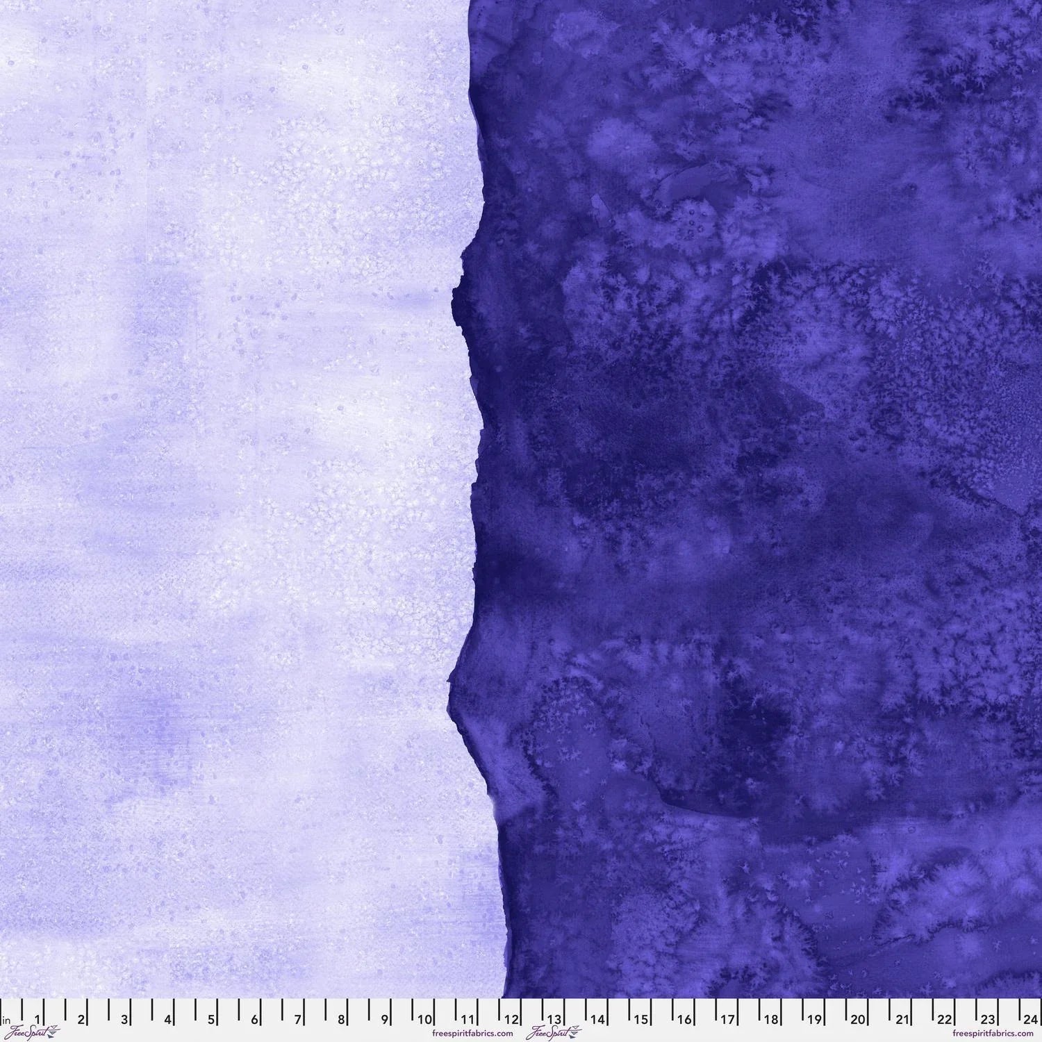 Abstract fabric pattern with a watercolor-like texture featuring dark indigo and light, lilac purple. Ruler at the bottom for scale.