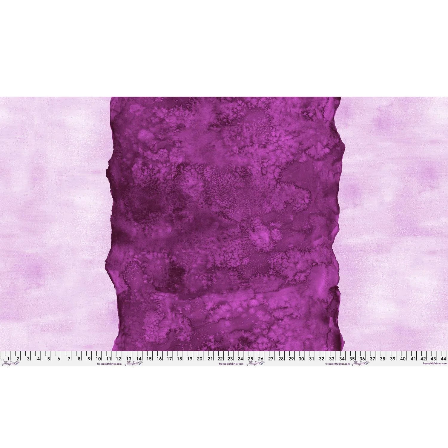 Abstract fabric pattern with a watercolor-like texture featuring a central stripe of dark magenta and outer light, raspberry pink edges. Ruler at the bottom for scale.
