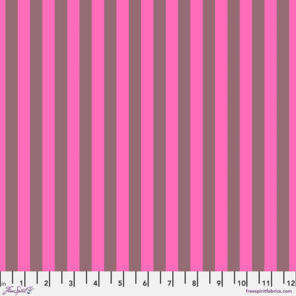 Neon Tent Stripe in Cosmic features alternating bright fuchsia and dusty magenta stripes that run parallel to the selvage. 12 inch ruler at the bottom for scale