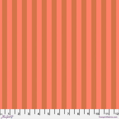 Neon Tent Stripe in Lunar features alternating salmon and coral stripes that run parallel to the selvage. 12 inch ruler at the bottom for scale