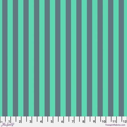 Neon Tent Stripe in Spirit features alternating teal and jade stripes that run parallel to the selvage. 12 inch ruler at the bottom for scale