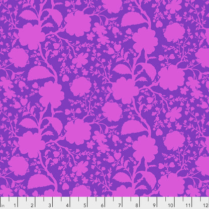 True Colors Wildflower in Dahlia features bold fuchsia silhouettes of tangled blooming vines contrasted against a violet background. This modern floral print highlights interesting color combinations, kickstarts quilts, and brings every project to life.