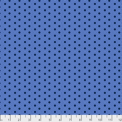 True Colors Hexy in Deep Sea features bold dots of navy blue that form the centers of bright blue hexagons.