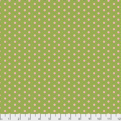 True Colors Hexy in Juniper features bright dots of soft pink that form the centers of small green hexagons.