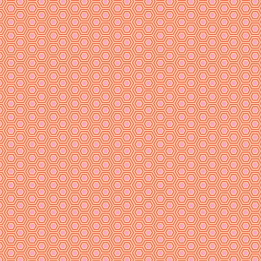 True Colors Hexy in Peach Blossom features soft pink dots that form the centers of small peach hexagons.