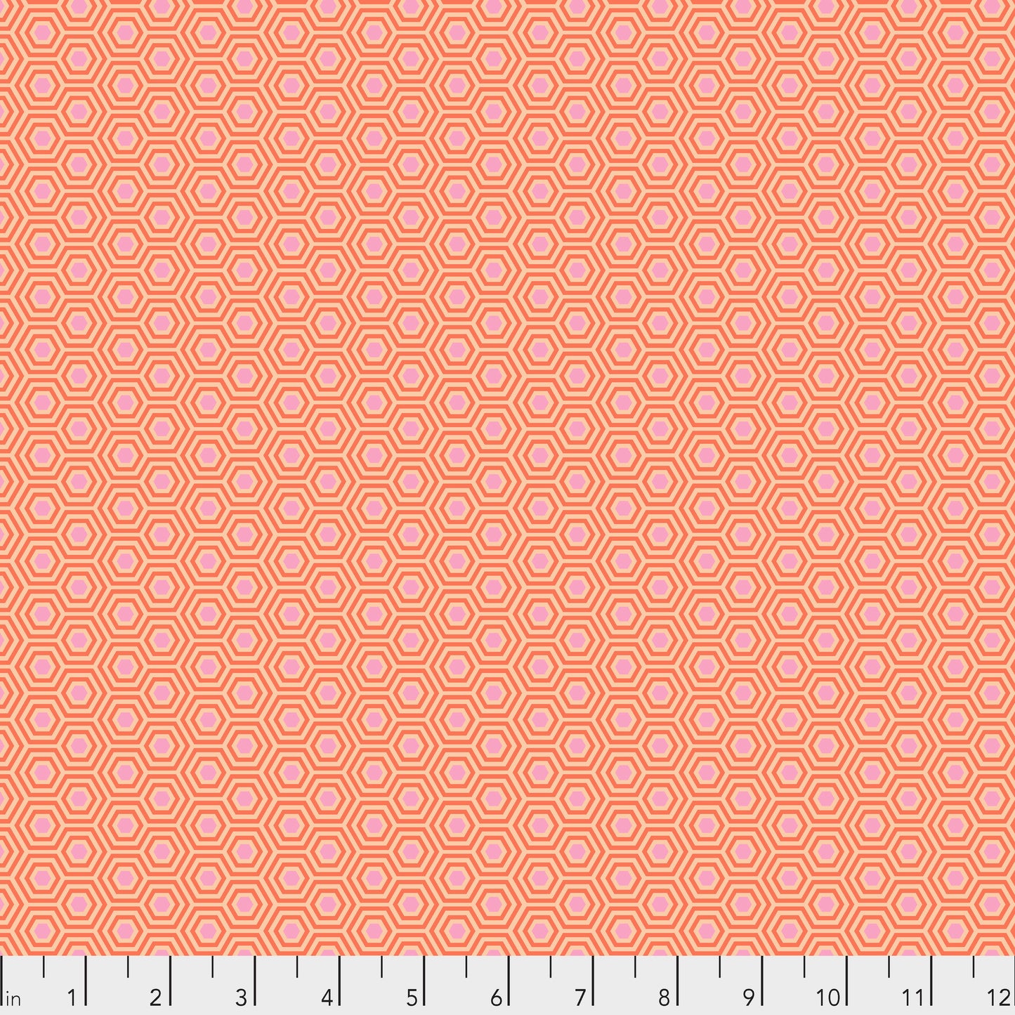 True Colors Hexy in Peach Blossom features soft pink dots that form the centers of small peach hexagons.