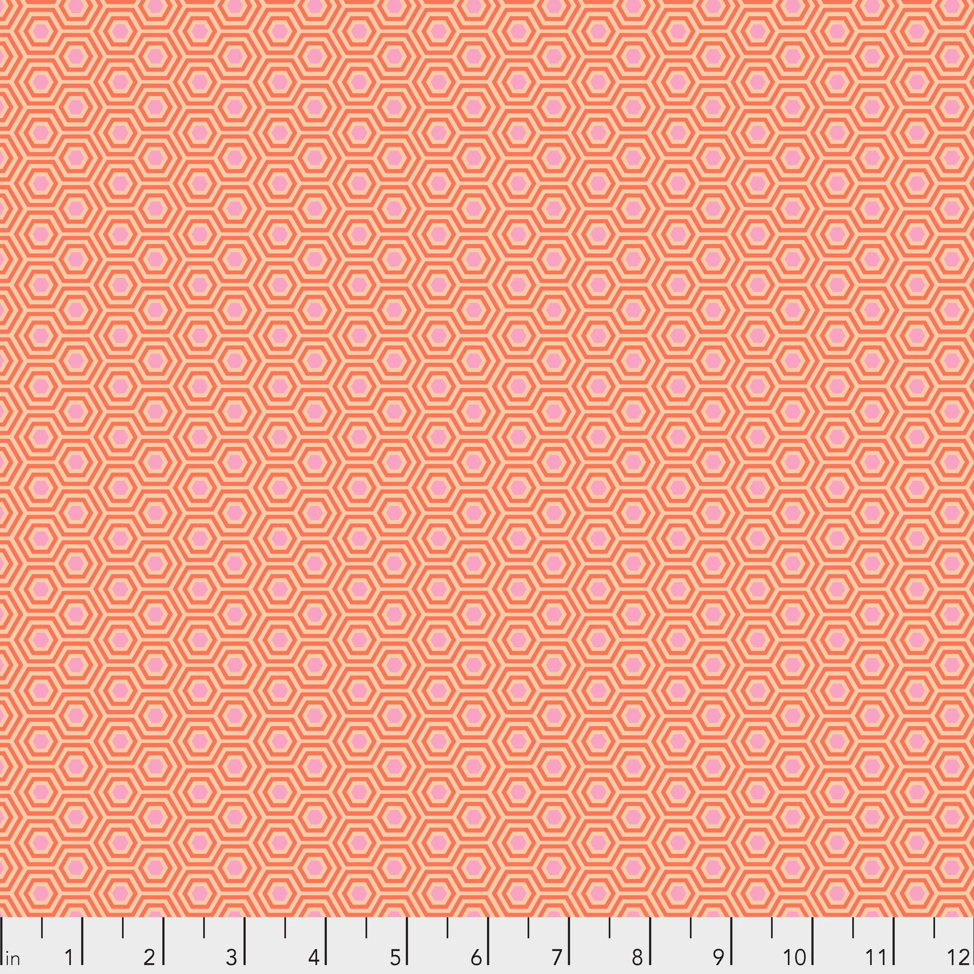 True Colors Hexy in Peach Blossom features soft pink dots that form the centers of small peach hexagons.