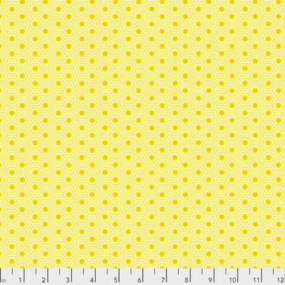 True Colors Hexy in Sunshine features bright dots of gold that form the centers of small yellow hexagons.