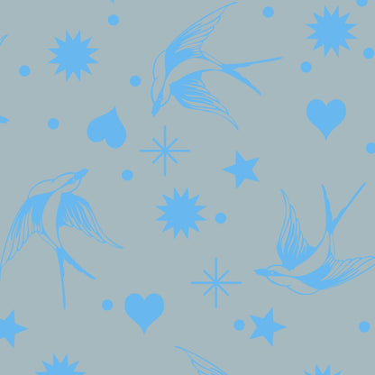 Neon Fairy Flakes in Aura features blue swooping birds, stars, hearts, and dots tossed across a blue-grey background.