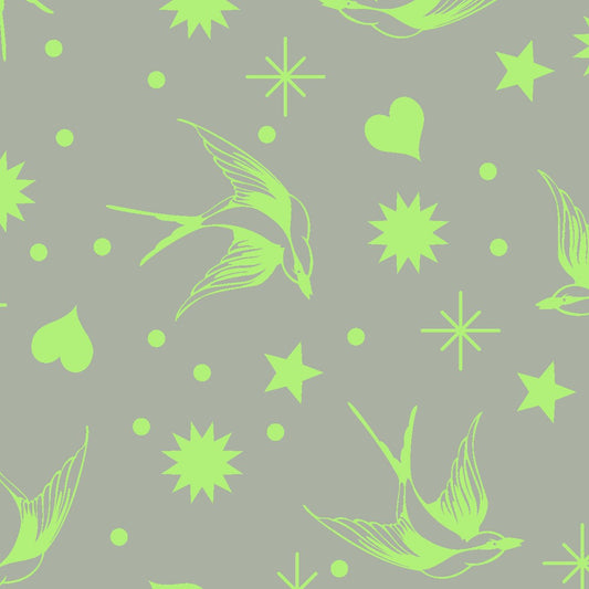 Neon Fairy Flakes in Karma features lime green swooping birds, stars, hearts, and dots tossed across a grey-green background.