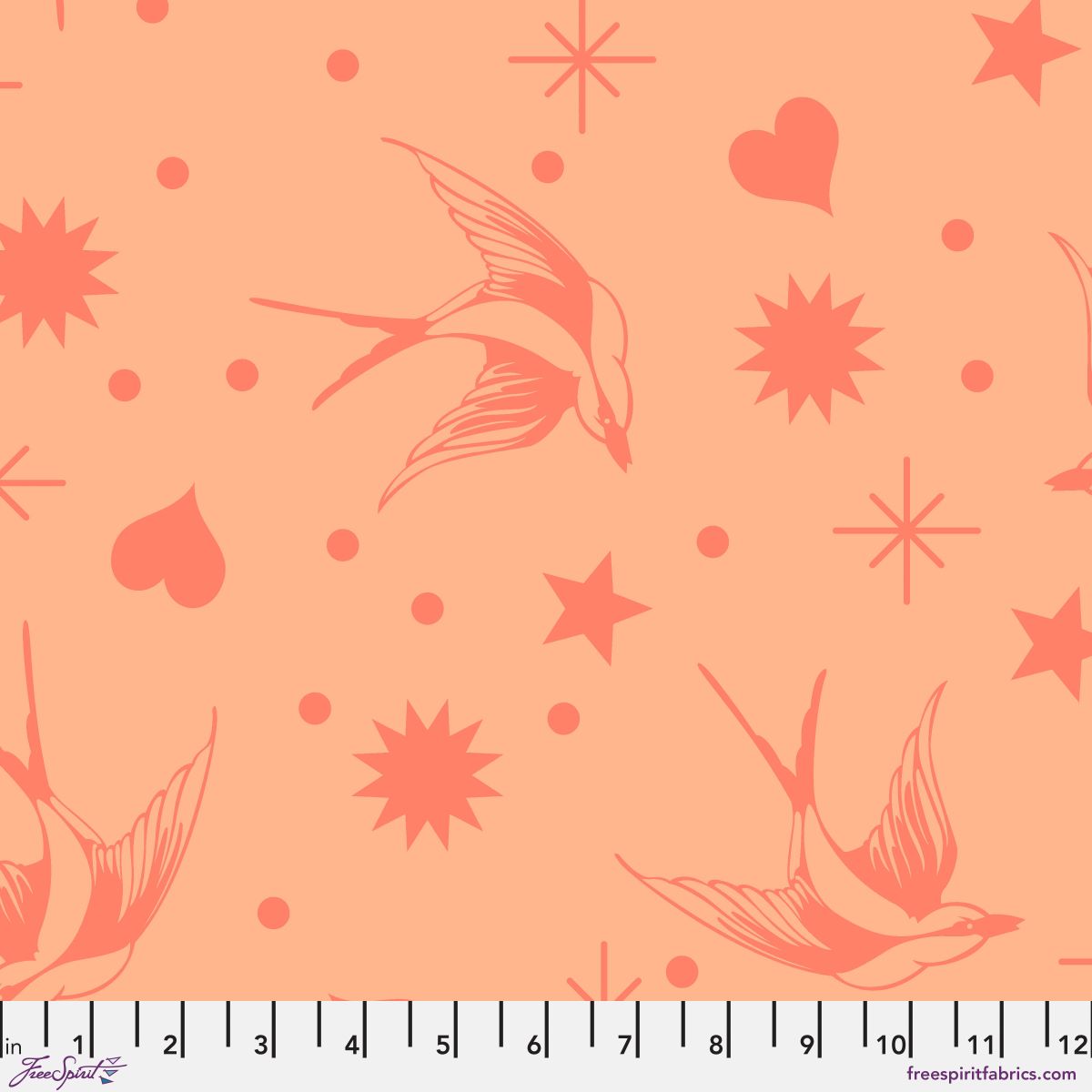 Neon Fairy Flakes in Lunar features coral pink swooping birds, stars, hearts, and dots tossed across a peach background. 12 inch ruler at the bottom for scale