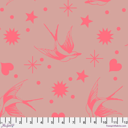 Neon Fairy Flakes in Nova features strawberry pink swooping birds, stars, hearts, and dots tossed across a rosy-grey background. 12 inch ruler at the bottom for scale