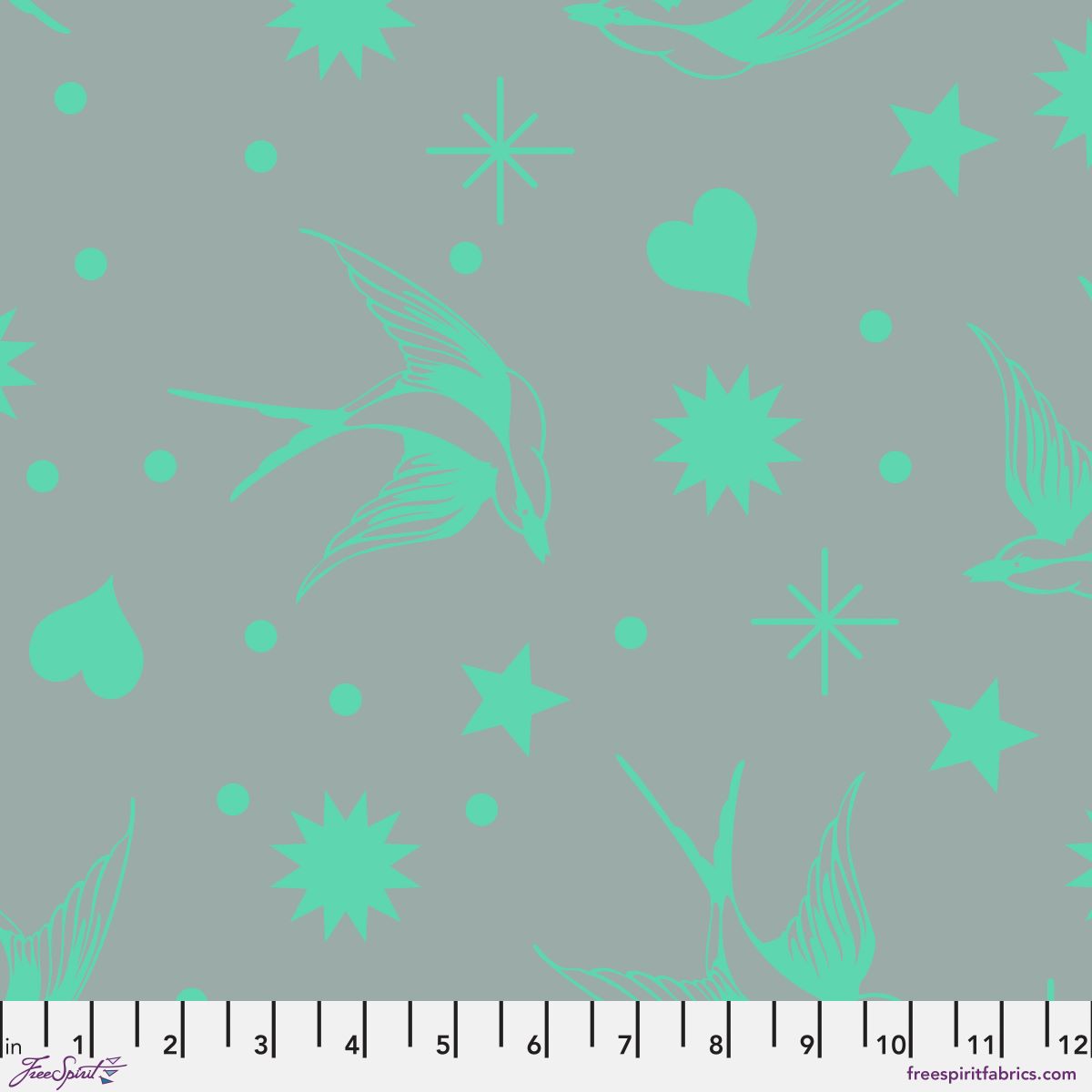 Neon Fairy Flakes in Spirit features teal swooping birds, stars, hearts, and dots tossed across a teal-grey background. 12 inch ruler at the bottom for scale