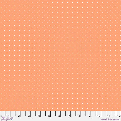 True Colors Tiny Dots in Peachy features tiny white pin dots on a soft peachy-orange background.